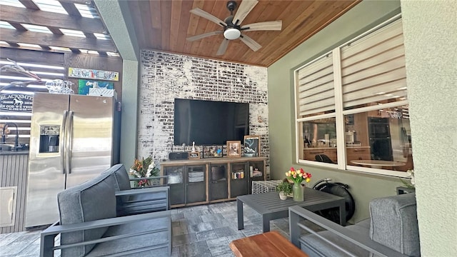 interior space with a sink and a ceiling fan