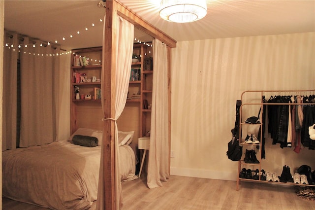 bedroom featuring wood finished floors