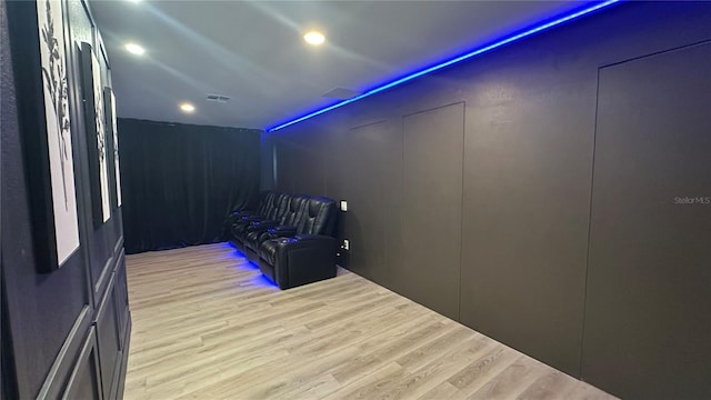 empty room featuring light wood-type flooring, visible vents, and recessed lighting