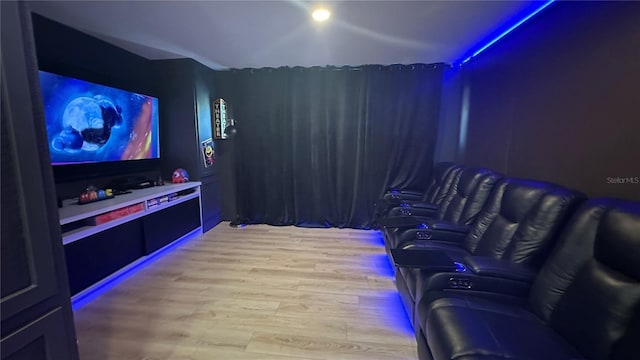 home theater room featuring wood finished floors