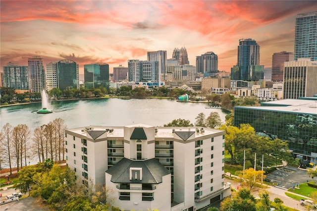 exterior space featuring a view of city and a water view