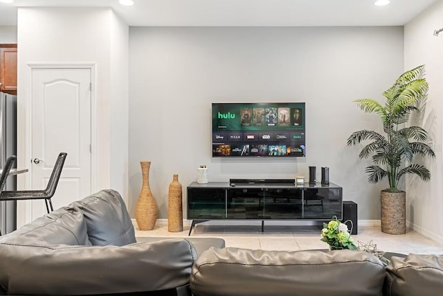 living area with tile patterned flooring, baseboards, and recessed lighting