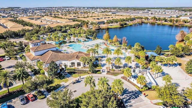 drone / aerial view with a water view and a residential view