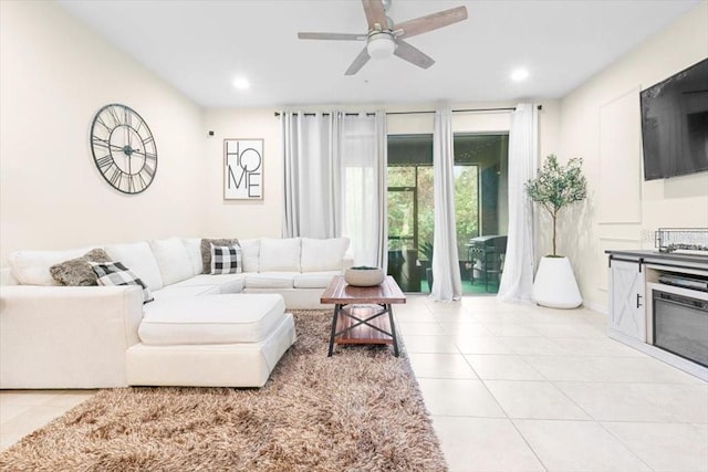 living area featuring recessed lighting, ceiling fan, and light tile patterned flooring