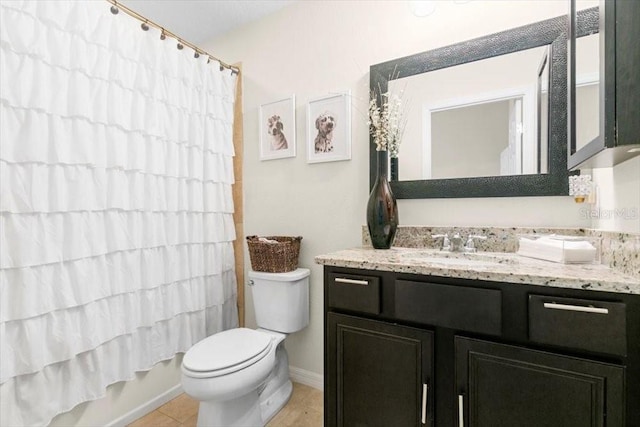 full bath with tile patterned flooring, vanity, and toilet