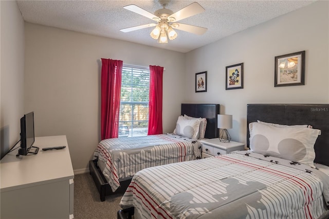 bedroom with carpet, baseboards, ceiling fan, and a textured ceiling