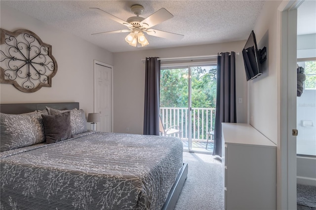 bedroom featuring carpet floors, access to exterior, multiple windows, and a textured ceiling