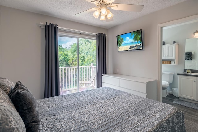 bedroom featuring a ceiling fan, dark wood-style flooring, ensuite bathroom, access to exterior, and a textured ceiling