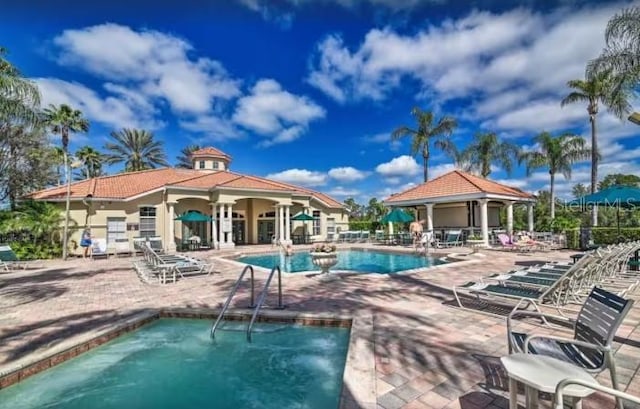 pool featuring a patio area and fence