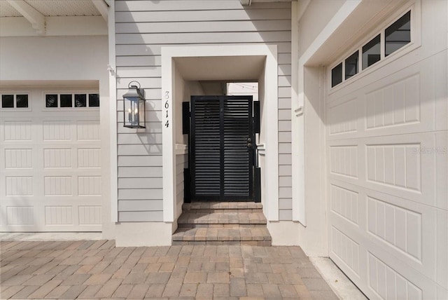 property entrance with a garage