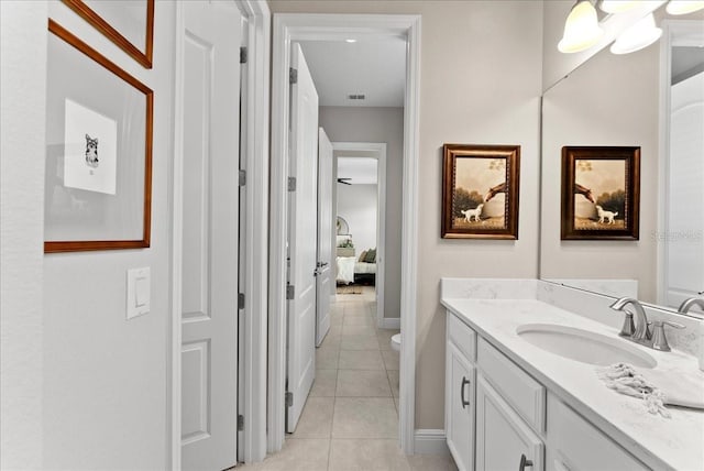 ensuite bathroom featuring ensuite bathroom, toilet, visible vents, vanity, and tile patterned floors