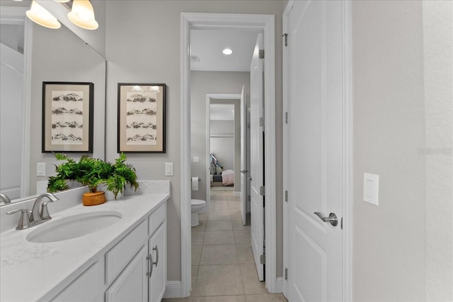 full bath with toilet, tile patterned floors, and vanity