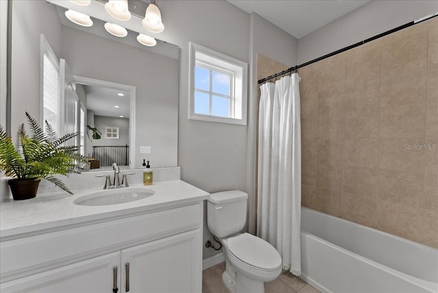 full bathroom with baseboards, toilet, tile patterned floors, shower / bathtub combination with curtain, and vanity