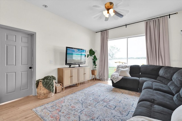 living room featuring wood finished floors and a ceiling fan