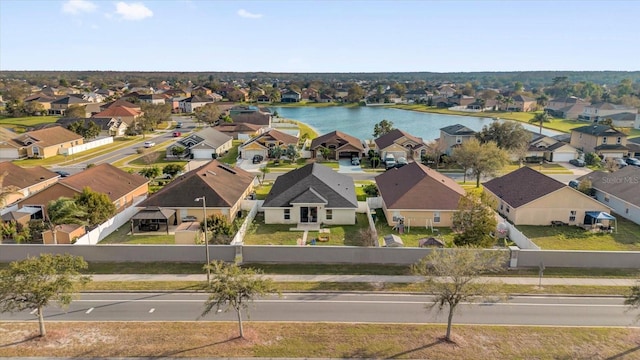 aerial view featuring a residential view and a water view