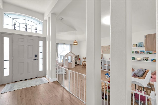 entrance foyer with wood finished floors and visible vents