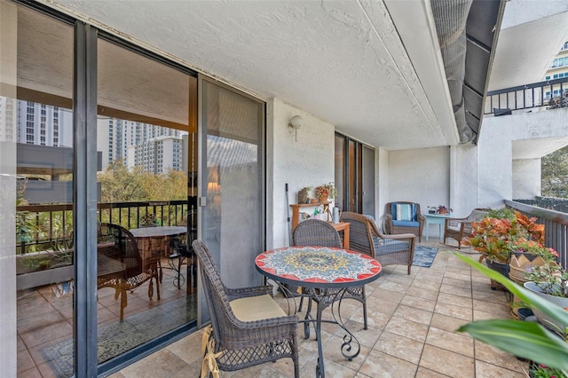 view of patio featuring a balcony