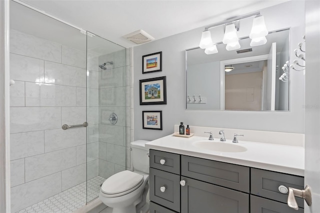 full bath featuring toilet, a stall shower, visible vents, and vanity