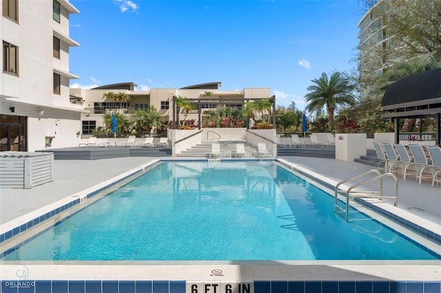 community pool with a patio area