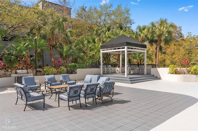 view of patio with an outdoor hangout area, area for grilling, and a gazebo