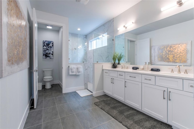 full bath featuring a walk in shower, toilet, a sink, baseboards, and double vanity