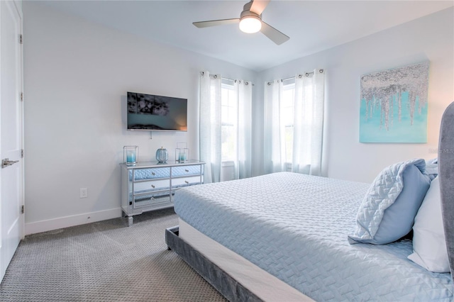 bedroom featuring ceiling fan, baseboards, and carpet flooring