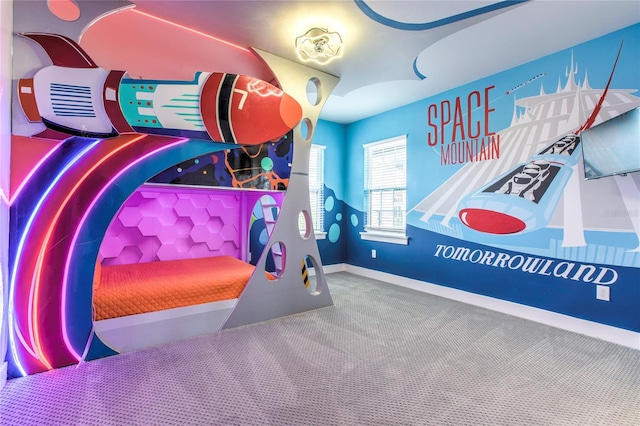 playroom featuring baseboards and carpet flooring