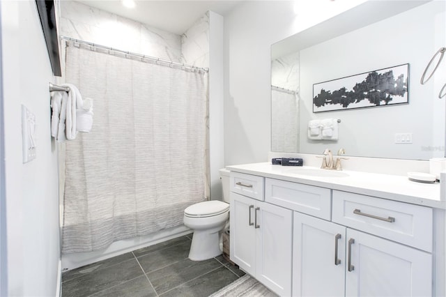 full bathroom featuring toilet, tile patterned floors, and vanity