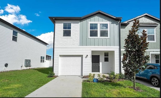 view of front facade with concrete driveway, a front lawn, board and batten siding, and an attached garage