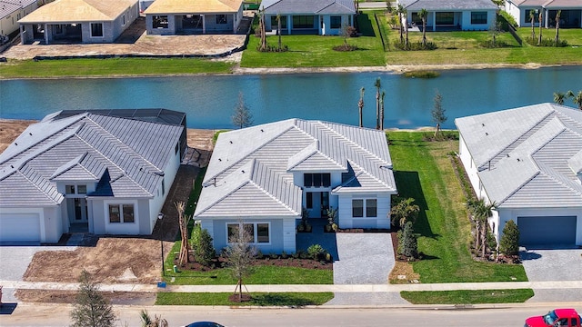 bird's eye view featuring a water view and a residential view