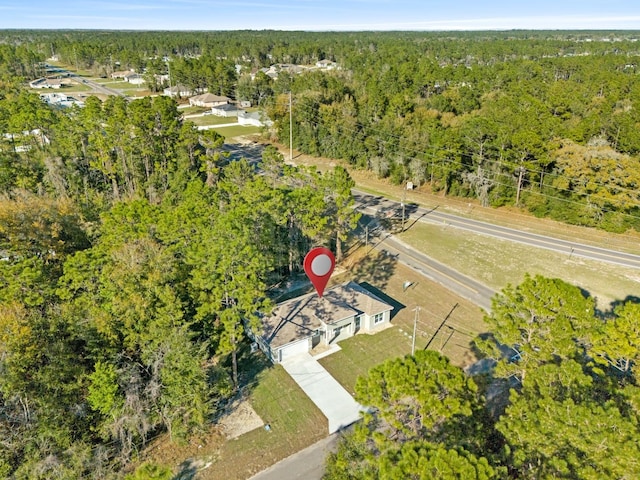 bird's eye view featuring a view of trees