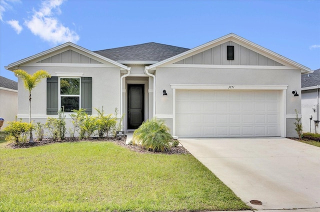 view of front of home featuring a garage, a shingled roof, concrete driveway, a front lawn, and board and batten siding