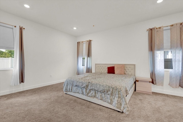 bedroom with recessed lighting and carpet floors