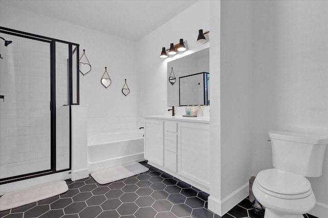 bathroom with tile patterned floors, toilet, a bath, vanity, and a stall shower