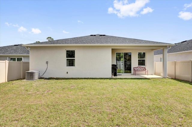 rear view of property with central AC, fence, stucco siding, and a patio area