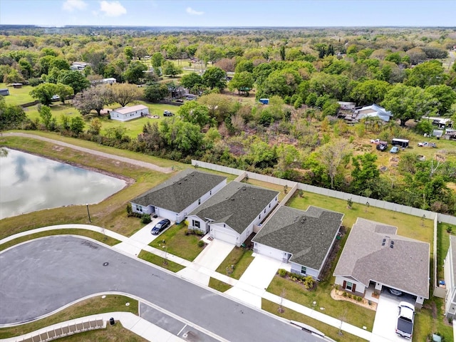 birds eye view of property featuring a residential view and a water view