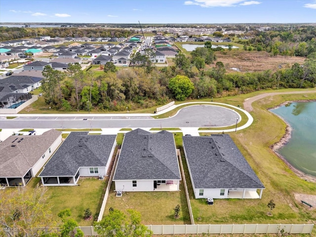 aerial view featuring a residential view and a water view