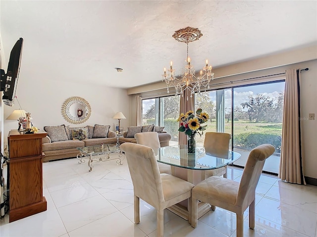 dining space with a notable chandelier