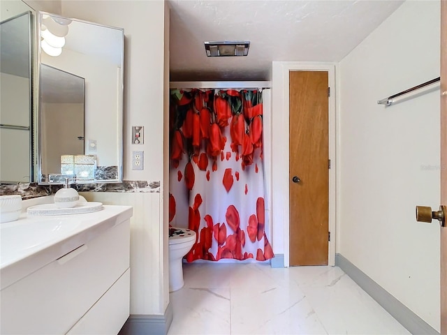 full bathroom featuring baseboards, toilet, a shower with shower curtain, marble finish floor, and vanity