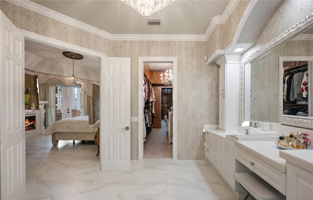 bathroom with a chandelier, visible vents, marble finish floor, and wallpapered walls