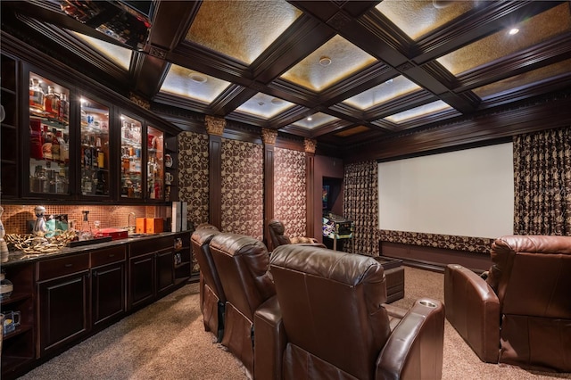 carpeted cinema room featuring indoor wet bar, coffered ceiling, and ornamental molding