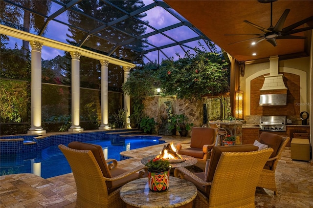 view of swimming pool featuring area for grilling, a patio area, and an outdoor kitchen