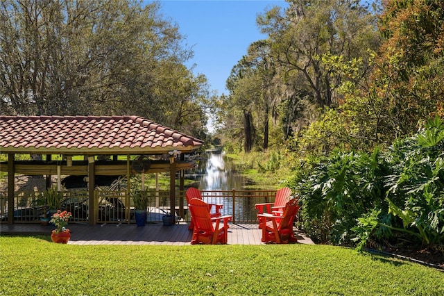 view of yard with a gazebo and a water view