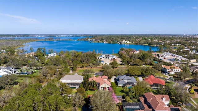 drone / aerial view featuring a residential view and a water view