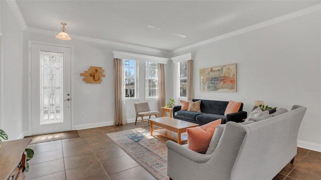 living area featuring baseboards, dark tile patterned floors, and crown molding