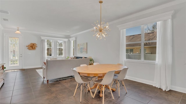 dining area featuring visible vents, crown molding, and baseboards