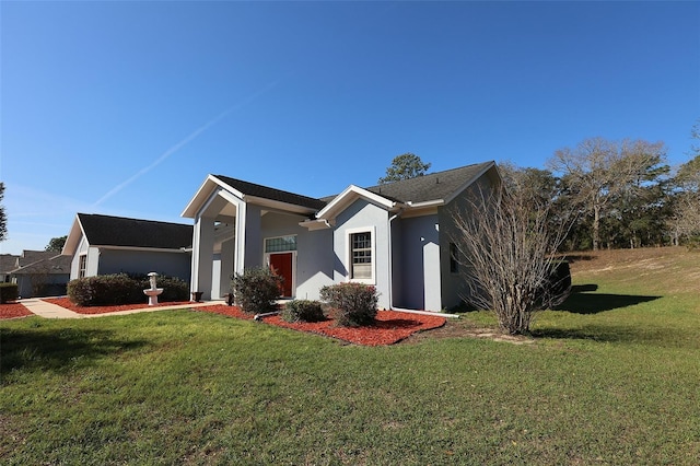 view of home's exterior with a lawn and stucco siding