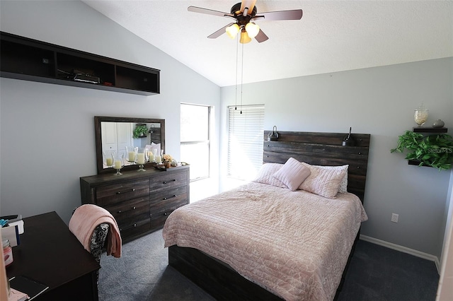 bedroom with ceiling fan, baseboards, dark carpet, and vaulted ceiling