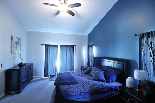 bedroom with a ceiling fan, carpet, lofted ceiling, and baseboards