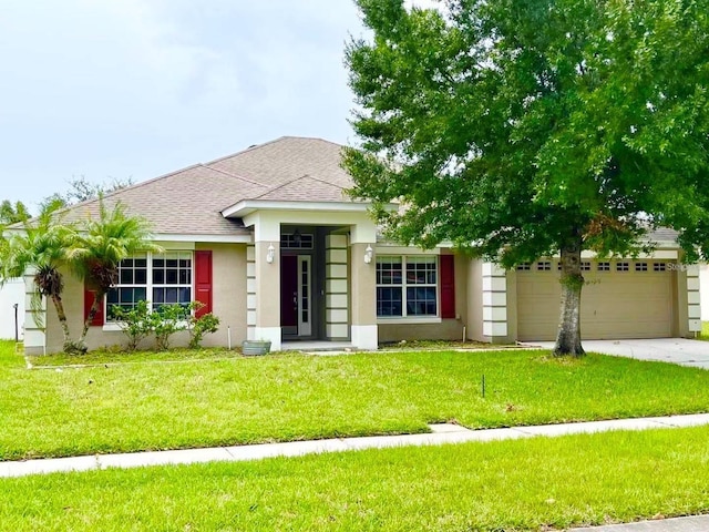 single story home with roof with shingles, stucco siding, an attached garage, driveway, and a front lawn